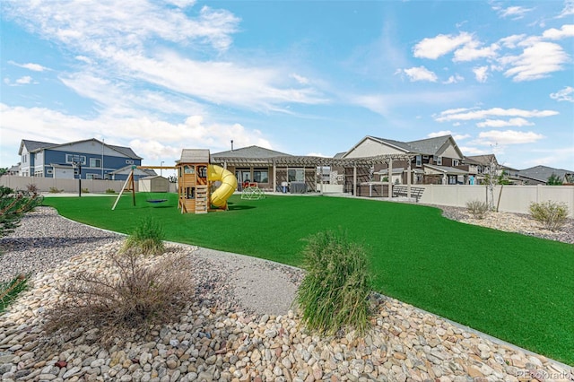 view of yard with a residential view, playground community, a fenced backyard, and a pergola