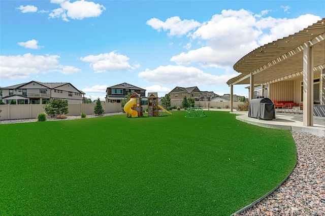 view of yard featuring a pergola, a fenced backyard, a playground, a residential view, and a patio area