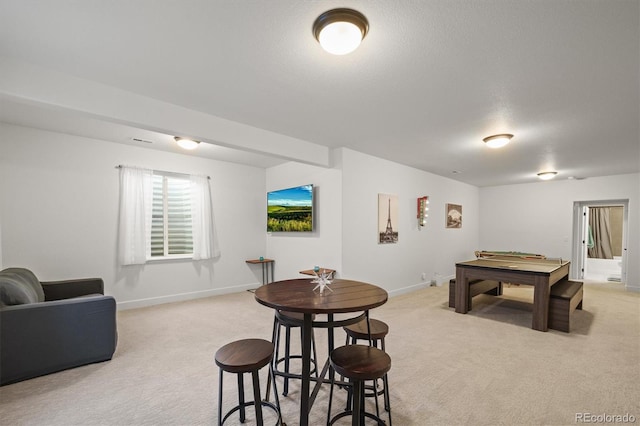 rec room featuring baseboards and light colored carpet