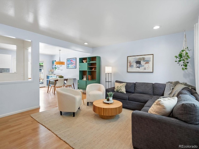 10109 W 68th Ave, Arvada, CO 80004 - living area featuring wood finished floors, recessed lighting, and baseboards