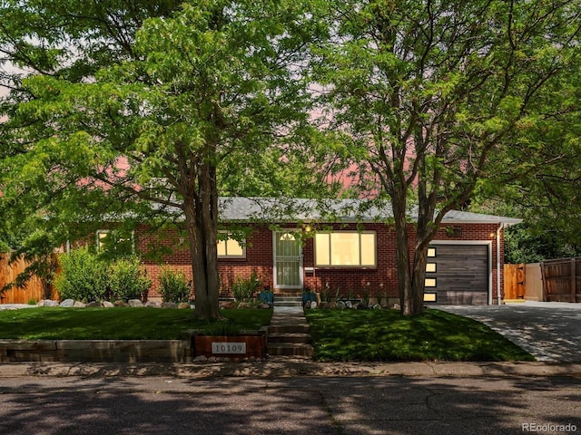 10109 W 68th Ave, Arvada, CO 80004 - view of front of property featuring concrete driveway, brick siding, and a garage