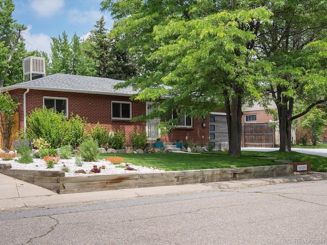 10109 W 68th Ave, Arvada, CO 80004 - view of front facade featuring brick siding and a shingled roof