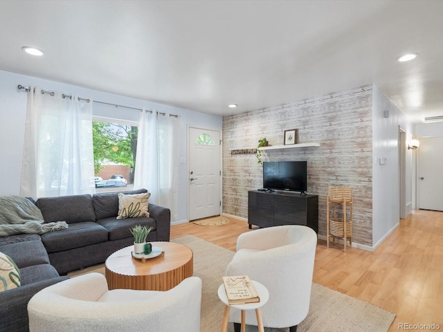 10109 W 68th Ave, Arvada, CO 80004 - living room featuring light wood-style floors, recessed lighting, baseboards, and an accent wall