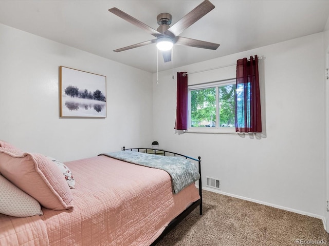 10109 W 68th Ave, Arvada, CO 80004 - carpeted bedroom featuring baseboards and a ceiling fan