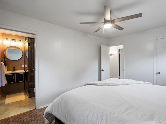 10109 W 68th Ave, Arvada, CO 80004 - carpeted bedroom with baseboards, a ceiling fan, and connected bathroom