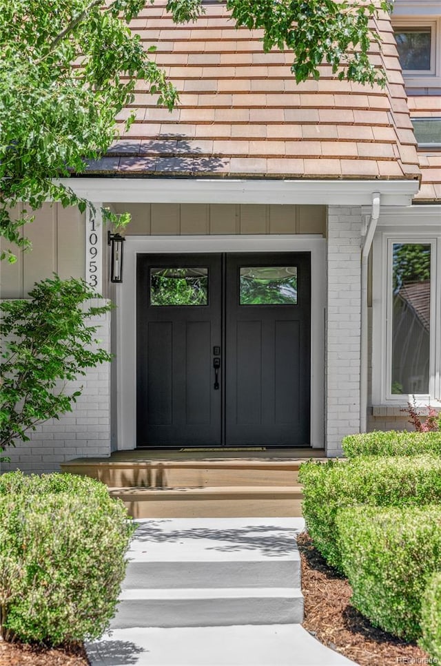 10953 E Crestline Ave, Englewood, CO 80111 - doorway to property featuring brick siding