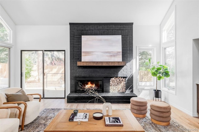 10953 E Crestline Ave, Englewood, CO 80111 - living room featuring wood finished floors and a brick fireplace