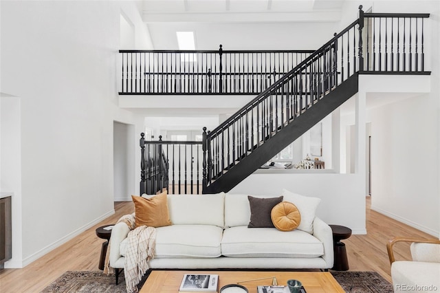 10953 E Crestline Ave, Englewood, CO 80111 - living area featuring a high ceiling, wood finished floors, and stairs