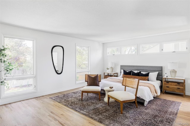 10953 E Crestline Ave, Englewood, CO 80111 - bedroom with multiple windows and light wood-type flooring