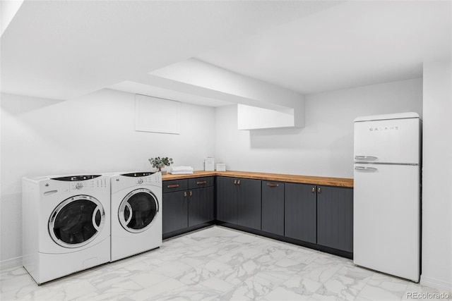 10953 E Crestline Ave, Englewood, CO 80111 - laundry room featuring light marble finish flooring and separate washer and dryer