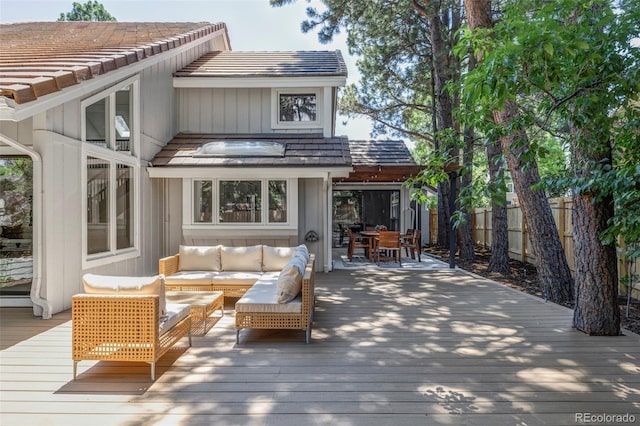 10953 E Crestline Ave, Englewood, CO 80111 - wooden terrace with outdoor dining area and an outdoor hangout area