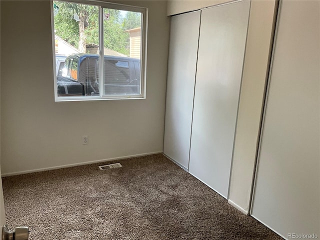 unfurnished bedroom with carpet