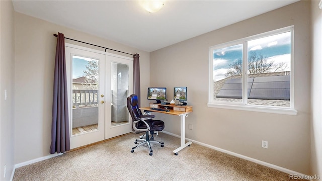 office space with baseboards, french doors, carpet flooring, and a wealth of natural light