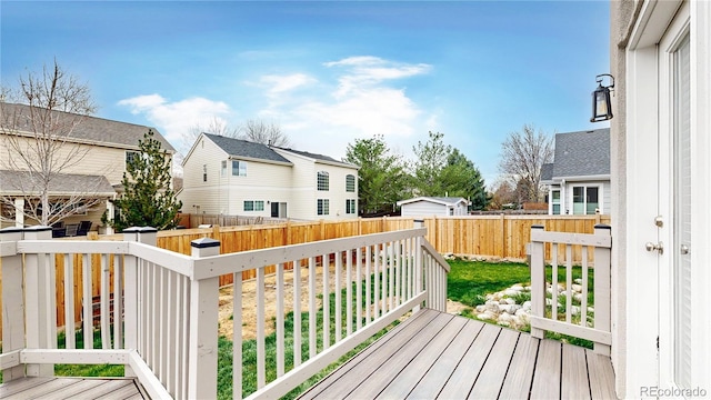 deck featuring a fenced backyard and a residential view