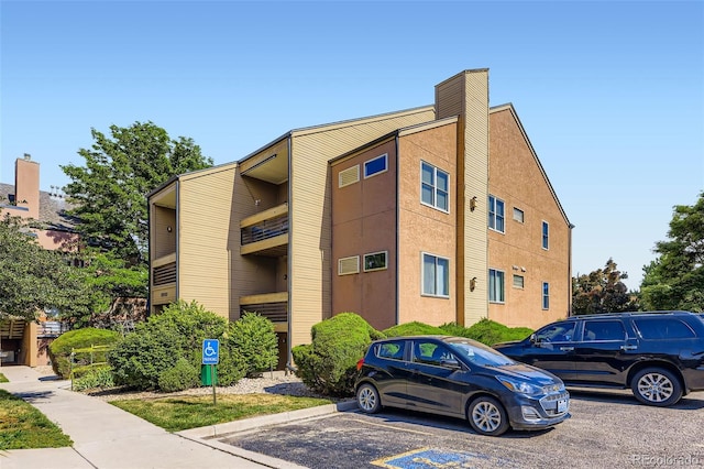 8900 Fox Dr Unit 1, Thornton, CO 80260 - view of property featuring uncovered parking