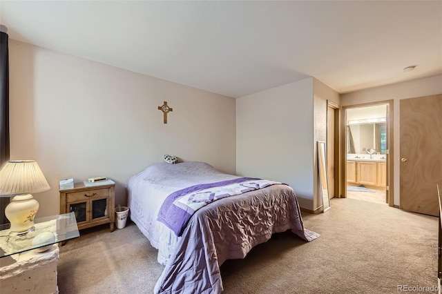 8900 Fox Dr Unit 1, Thornton, CO 80260 - carpeted bedroom with ensuite bath and a sink