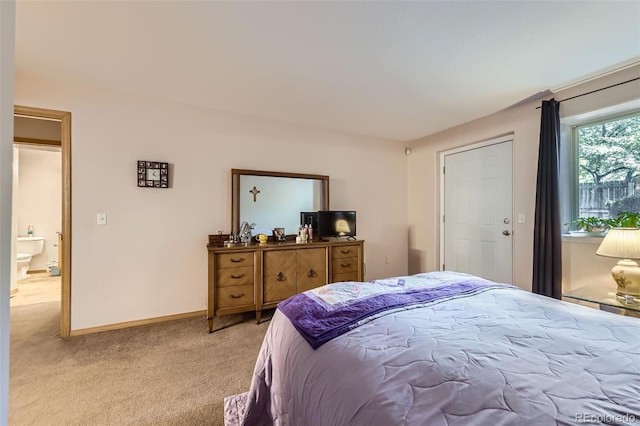8900 Fox Dr Unit 1, Thornton, CO 80260 - bedroom featuring light carpet and baseboards