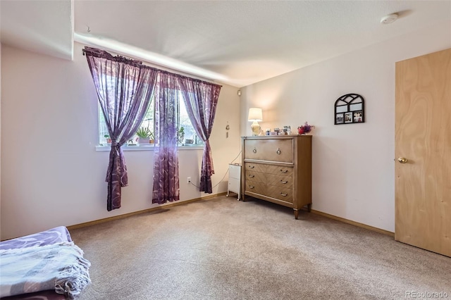 8900 Fox Dr Unit 1, Thornton, CO 80260 - carpeted bedroom with baseboards