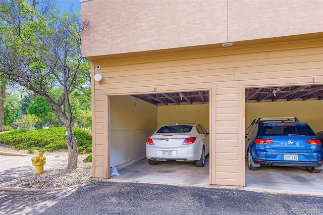 8900 Fox Dr Unit 1, Thornton, CO 80260 - garage featuring asphalt driveway