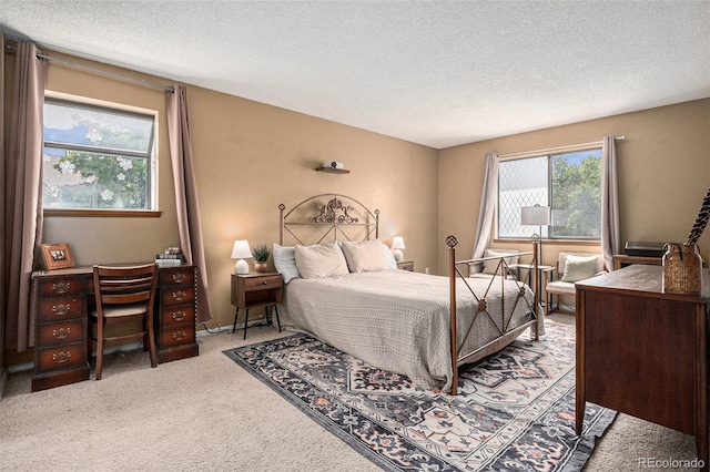 8600 E Alameda Ave Unit 21-208, Denver, CO 80247 - carpeted bedroom featuring a textured ceiling and an office area