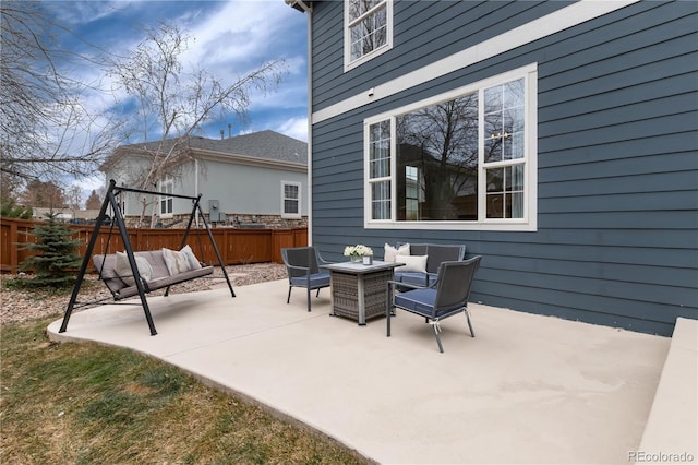 view of patio / terrace featuring outdoor dining area and fence