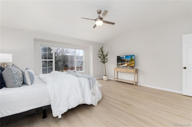 bedroom featuring lofted ceiling, ceiling fan, light wood finished floors, and baseboards