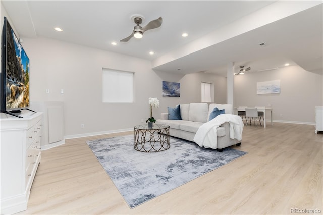 living room with ceiling fan, light wood finished floors, baseboards, and recessed lighting