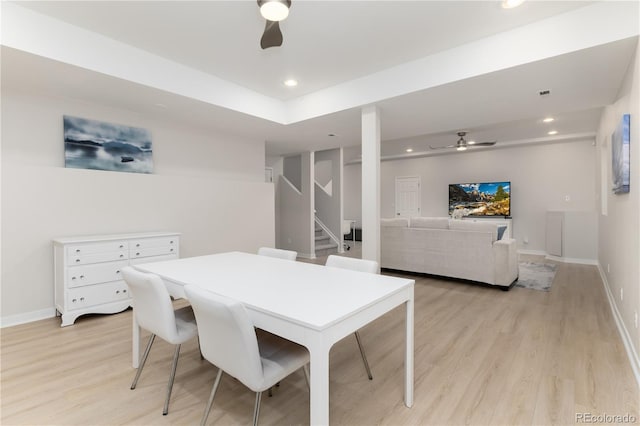 dining room with ceiling fan, recessed lighting, light wood-style floors, baseboards, and stairs