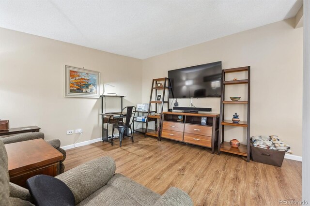 9625 E Center Ave Unit 5D, Denver, CO 80247 - living room with baseboards and light wood-type flooring