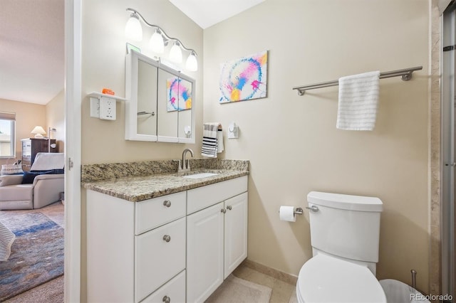 9625 E Center Ave Unit 5D, Denver, CO 80247 - ensuite bathroom with vanity, toilet, and baseboards