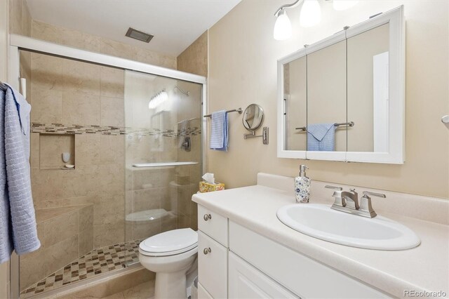 9625 E Center Ave Unit 5D, Denver, CO 80247 - full bathroom with vanity, toilet, and a stall shower