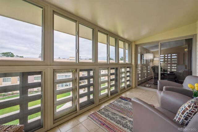 9625 E Center Ave Unit 5D, Denver, CO 80247 - sunroom with tile patterned flooring and lofted ceiling