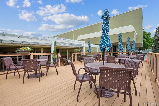 9625 E Center Ave Unit 5D, Denver, CO 80247 - wooden deck with outdoor dining space and a pergola