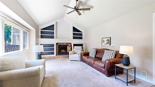 982 E 130th Cir, Thornton, CO 80241 - living room with a ceiling fan, carpet flooring, a fireplace, vaulted ceiling, and built in shelves