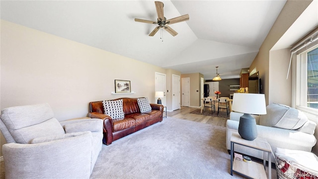 982 E 130th Cir, Thornton, CO 80241 - living room with a ceiling fan, light wood-style flooring, and vaulted ceiling