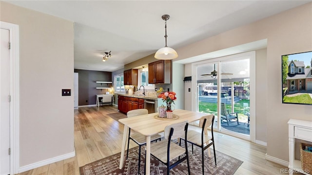 982 E 130th Cir, Thornton, CO 80241 - dining room with light wood-style flooring and a ceiling fan