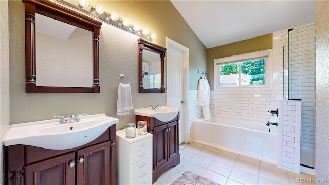 982 E 130th Cir, Thornton, CO 80241 - bathroom featuring tile patterned floors, a garden tub, vaulted ceiling, two vanities, and a shower