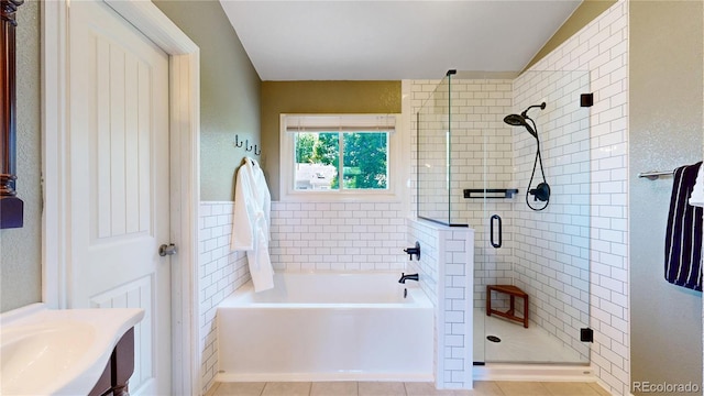 982 E 130th Cir, Thornton, CO 80241 - full bathroom with a garden tub, a stall shower, and tile patterned floors