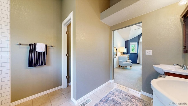 982 E 130th Cir, Thornton, CO 80241 - full bathroom with tile patterned floors and lofted ceiling