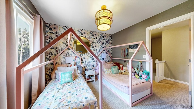 982 E 130th Cir, Thornton, CO 80241 - bedroom featuring wallpapered walls, carpet floors, and an accent wall