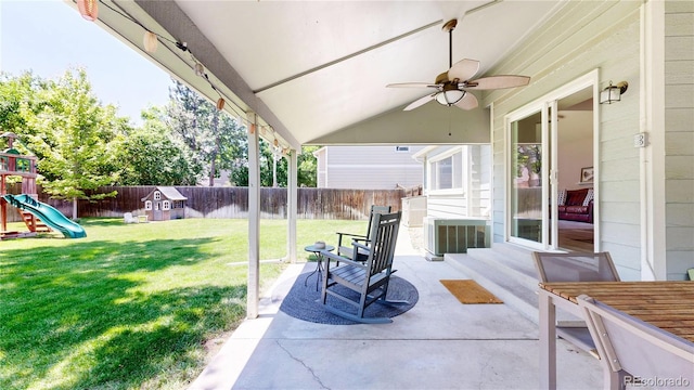 982 E 130th Cir, Thornton, CO 80241 - fenced backyard featuring a playground, a patio area, ceiling fan, and entry steps