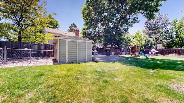 982 E 130th Cir, Thornton, CO 80241 - fenced backyard with a playground, a shed, and a wooden deck