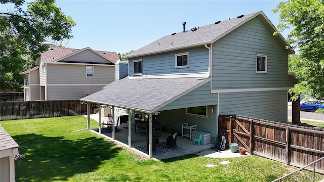 982 E 130th Cir, Thornton, CO 80241 - rear view of property with roof with shingles, a patio, and a fenced backyard