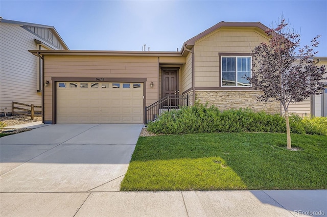 9679 Waco St, Commerce City, CO 80022 - view of front facade featuring driveway, a front lawn, an attached garage, and stone siding