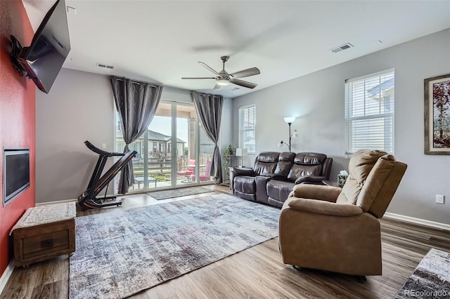 9679 Waco St, Commerce City, CO 80022 - living area with wood finished floors and ceiling fan