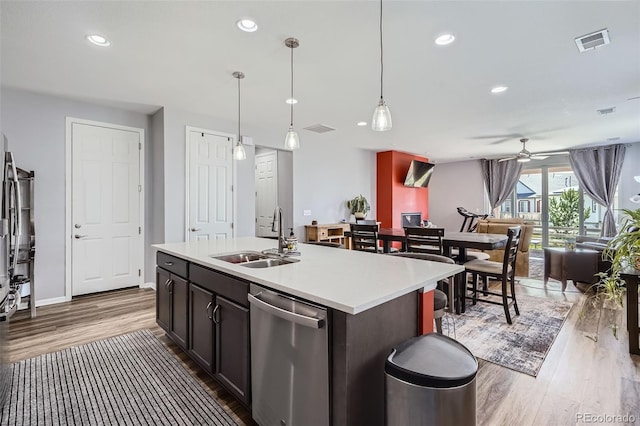 9679 Waco St, Commerce City, CO 80022 - kitchen with dishwasher, wood finished floors, a ceiling fan, light countertops, and open floor plan