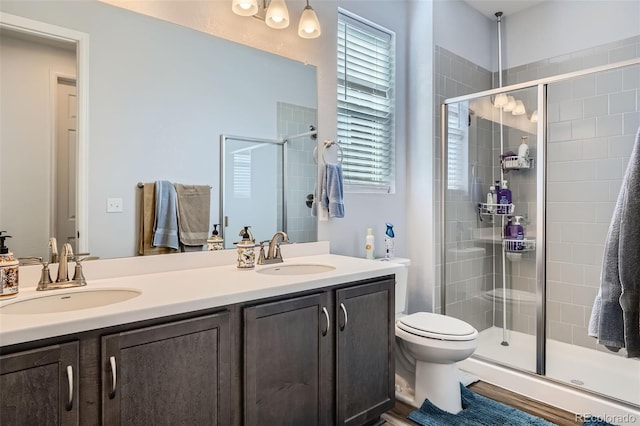 9679 Waco St, Commerce City, CO 80022 - full bathroom with double vanity and a shower stall