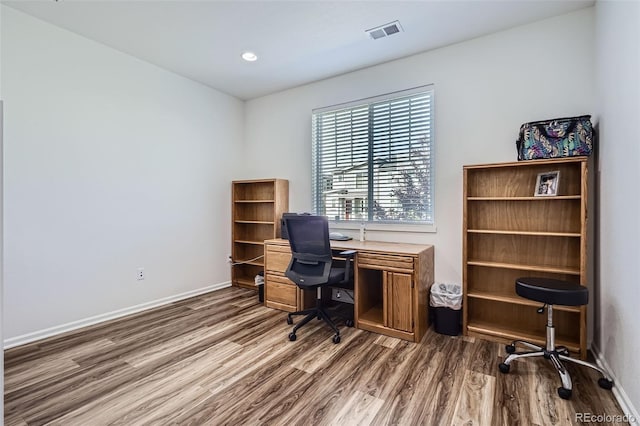 9679 Waco St, Commerce City, CO 80022 - home office featuring wood finished floors and recessed lighting