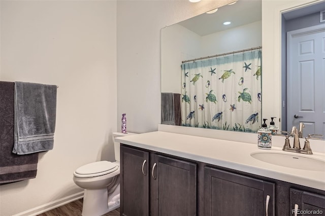 9679 Waco St, Commerce City, CO 80022 - full bathroom with vanity, wood finished floors, and a shower with curtain