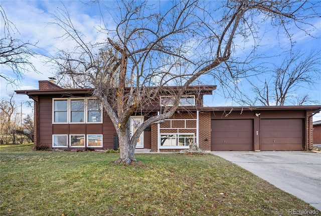 view of front of property featuring driveway, a front lawn, a garage, brick siding, and a chimney